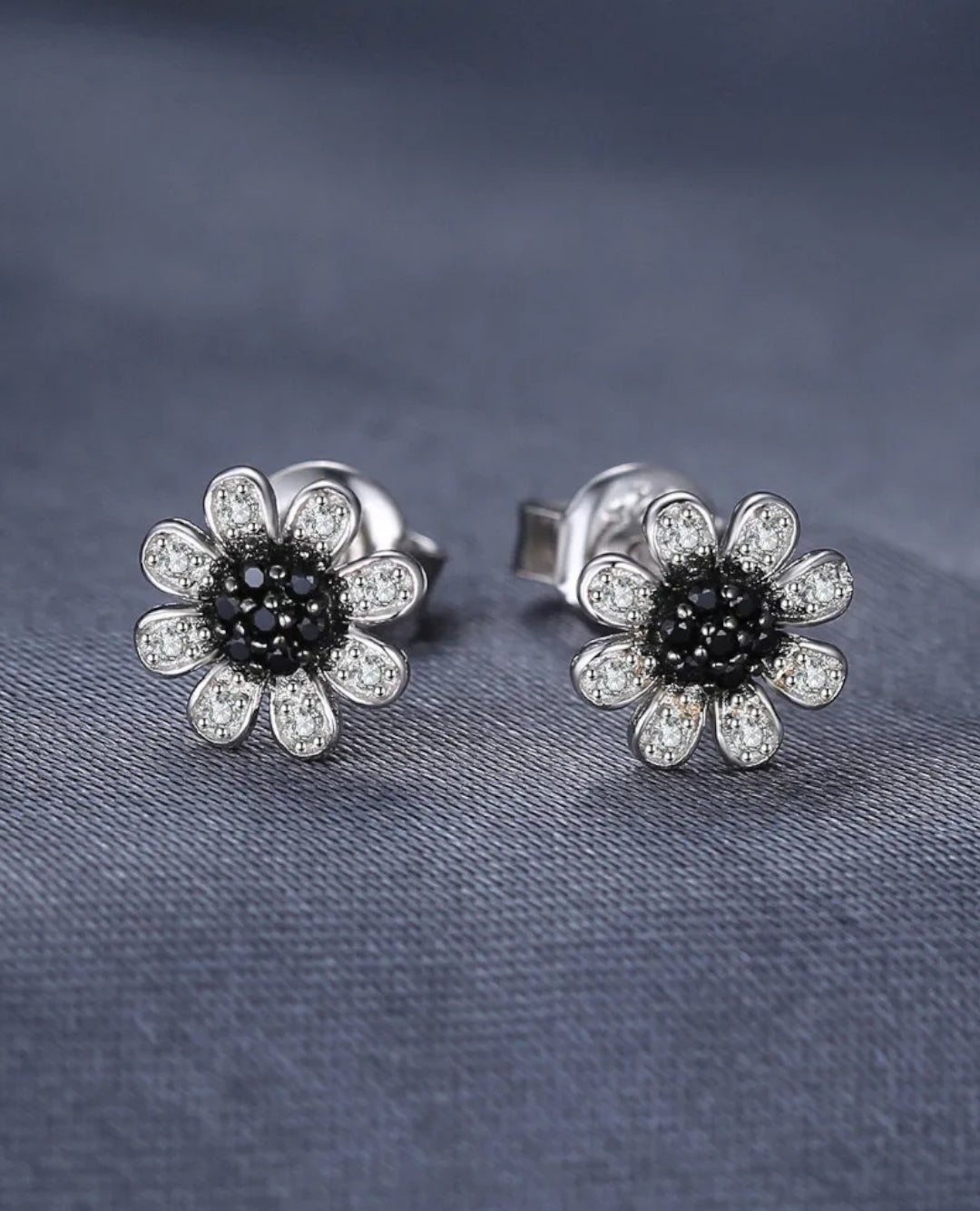 sterling silver floral studs — black spinel
